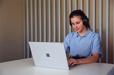 Student using technology in a modern classroom